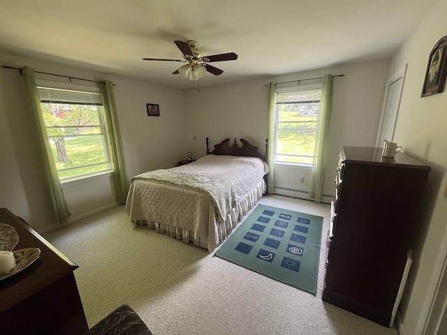 13 Bartlett St, Allenstown, NH 03275 - bedroom featuring light colored carpet, a baseboard radiator, and a ceiling fan