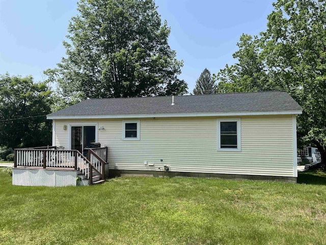 13 Bartlett St, Allenstown, NH 03275 - rear view of house featuring a wooden deck and a lawn