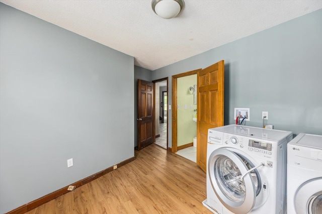 240 Middle Winchendon Rd, Rindge, NH 03461 - laundry area featuring washer and dryer and light wood-type flooring