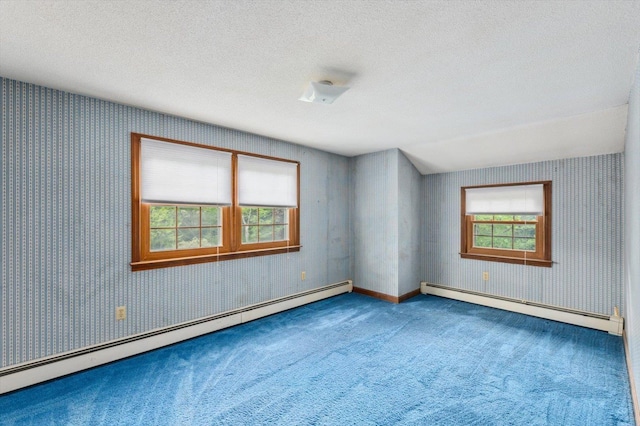 240 Middle Winchendon Rd, Rindge, NH 03461 - empty room featuring baseboard heating, carpet flooring, wallpapered walls, and a textured ceiling