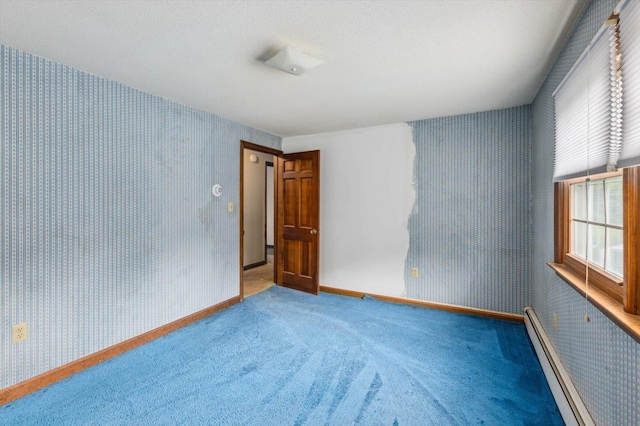 240 Middle Winchendon Rd, Rindge, NH 03461 - carpeted spare room with wallpapered walls and baseboard heating