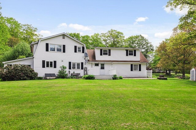 240 Middle Winchendon Rd, Rindge, NH 03461 - rear view of property with a gambrel roof, a yard, and an outdoor fire pit