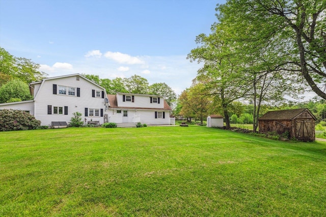 240 Middle Winchendon Rd, Rindge, NH 03461 - rear view of house featuring a shed, a gambrel roof, and a yard