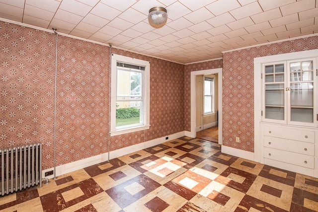 4 Walnut St, Exeter, NH 03833 - empty room with radiator, ornamental molding, and tile patterned floors