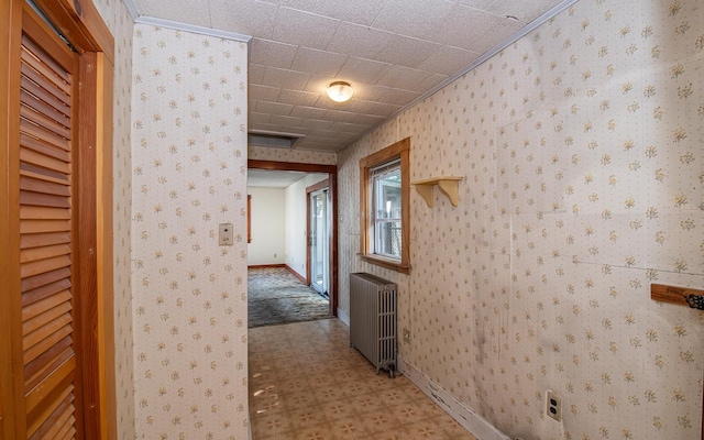 4 Walnut St, Exeter, NH 03833 - hall with radiator, tile patterned floors, and ornamental molding