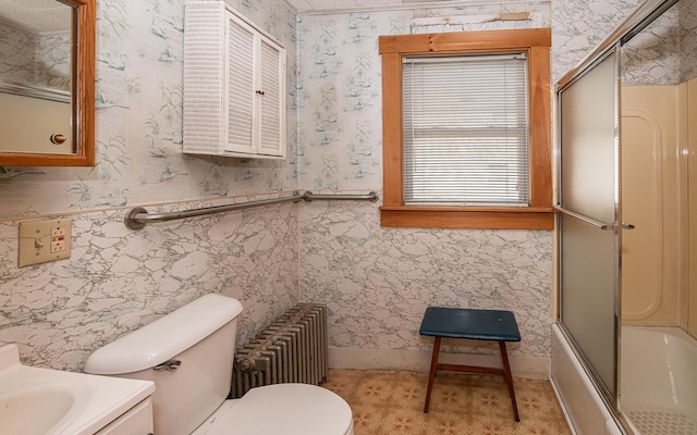 4 Walnut St, Exeter, NH 03833 - bathroom featuring vanity, bath / shower combo with glass door, a wainscoted wall, wallpapered walls, and radiator