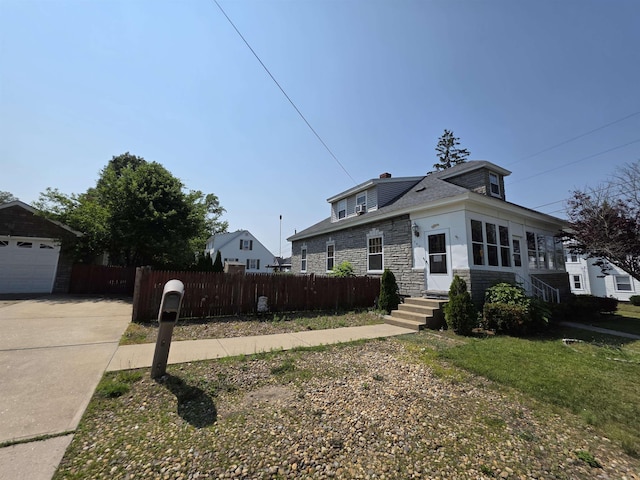 793 S Beech St, Manchester, NH 03104 - bungalow-style home with stone siding, driveway, and a garage