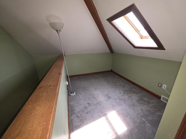 793 S Beech St, Manchester, NH 03104 - bonus room featuring a skylight, vaulted ceiling, and carpet flooring