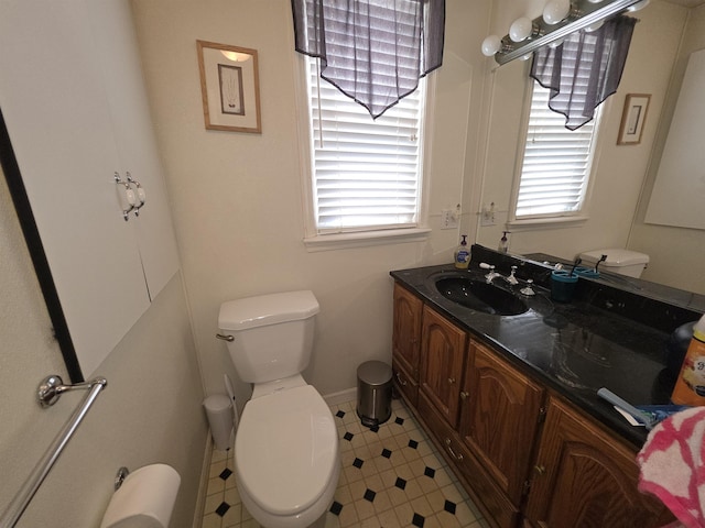 793 S Beech St, Manchester, NH 03104 - half bathroom featuring toilet and vanity
