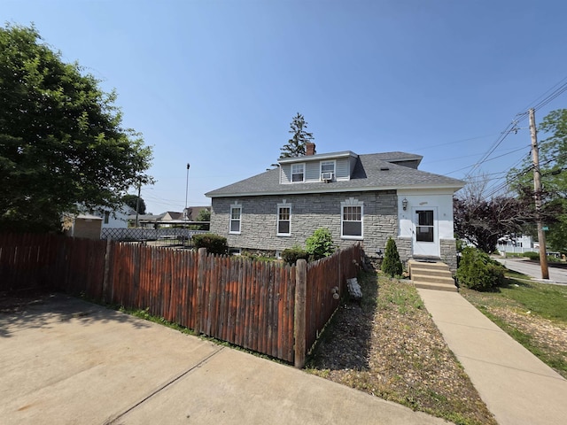 793 S Beech St, Manchester, NH 03104 - bungalow with stone siding and a chimney