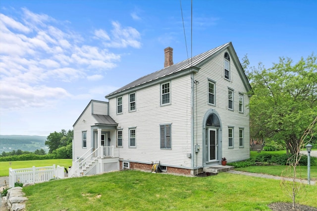 235 Dartmouth College Hwy, Haverhill, NH 03765 - view of front of house with a chimney and a metal roof