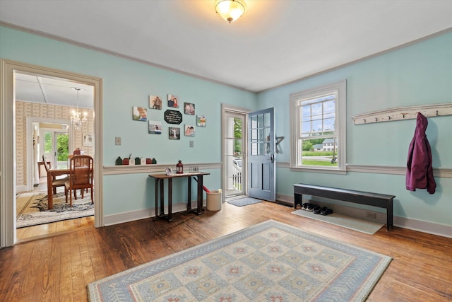 235 Dartmouth College Hwy, Haverhill, NH 03765 - entrance foyer featuring a chandelier, hardwood / wood-style floors, and ornamental molding