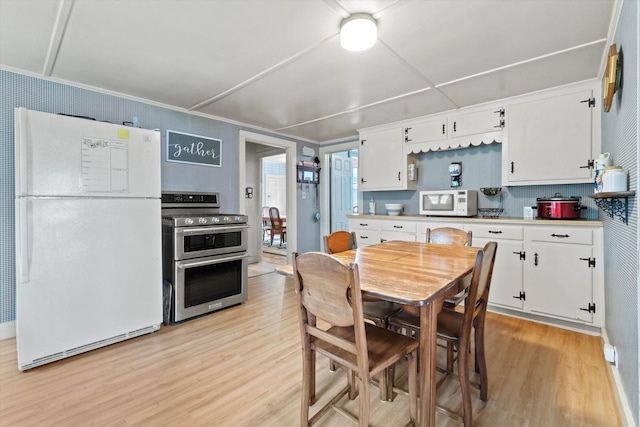 235 Dartmouth College Hwy, Haverhill, NH 03765 - kitchen featuring white appliances, light wood-style flooring, white cabinets, light countertops, and tasteful backsplash