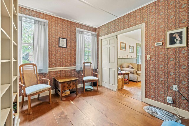 235 Dartmouth College Hwy, Haverhill, NH 03765 - sitting room with wallpapered walls, wood-type flooring, plenty of natural light, and ornamental molding