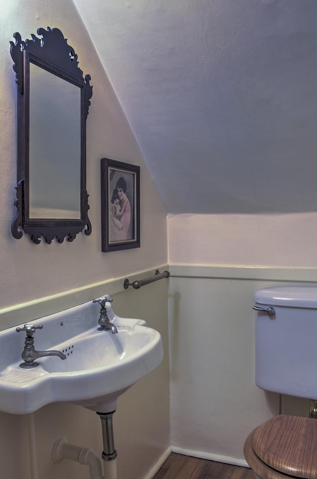 45 School St, Keene, NH 03431 - half bathroom with wood finished floors and vaulted ceiling