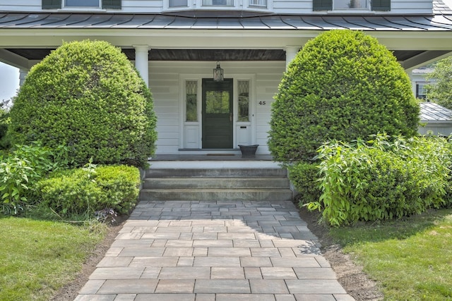 45 School St, Keene, NH 03431 - entrance to property featuring a standing seam roof, a metal roof, and covered porch