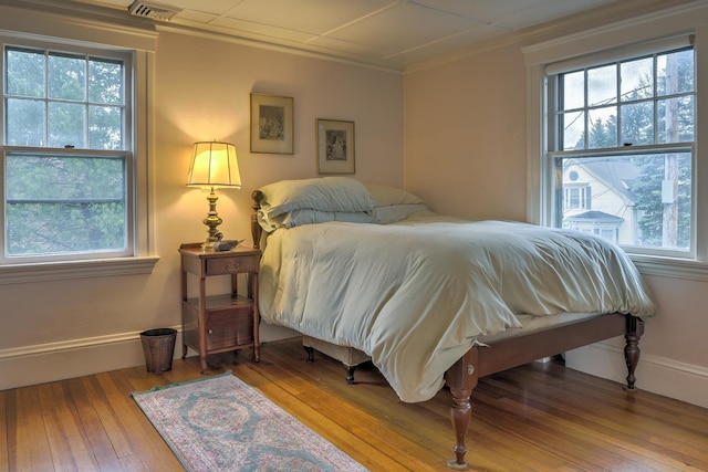 45 School St, Keene, NH 03431 - bedroom with multiple windows, hardwood / wood-style floors, and crown molding