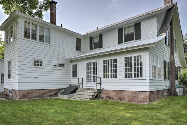 45 School St, Keene, NH 03431 - back of property featuring a chimney, entry steps, and a lawn