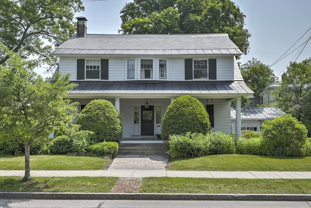 45 School St, Keene, NH 03431 - view of front facade featuring a standing seam roof, a metal roof, a chimney, a porch, and a front yard