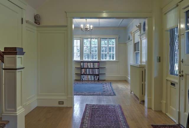 45 School St, Keene, NH 03431 - entrance foyer with a decorative wall, light wood finished floors, and a chandelier