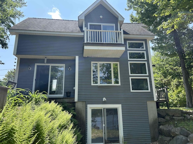 26 Island Dr, Madison, NH 03849 - back of house with a balcony and roof with shingles