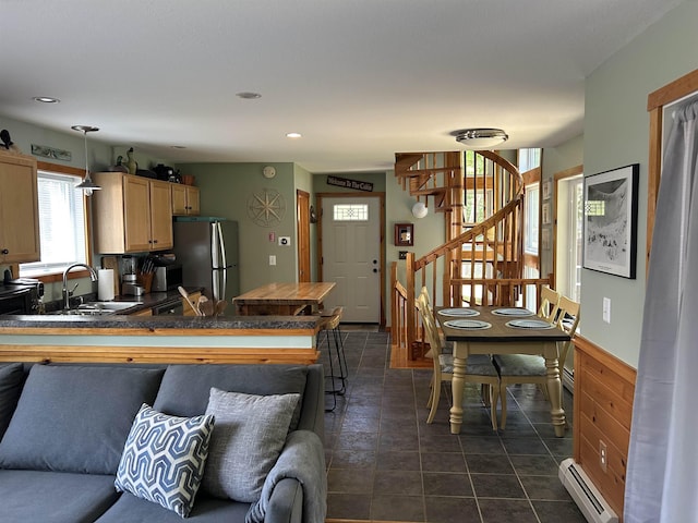26 Island Dr, Madison, NH 03849 - kitchen featuring freestanding refrigerator, a baseboard radiator, dark countertops, recessed lighting, and light brown cabinetry