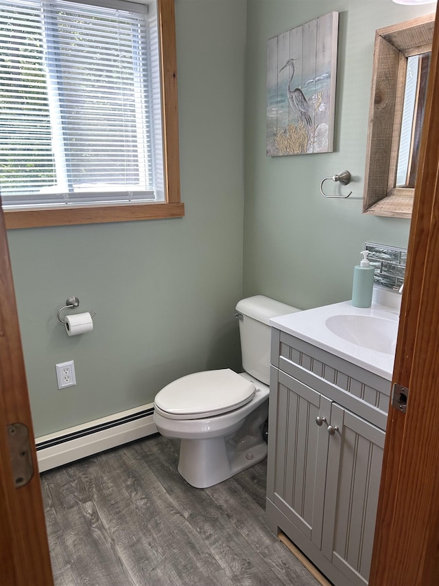 26 Island Dr, Madison, NH 03849 - bathroom featuring a baseboard radiator, vanity, and wood finished floors