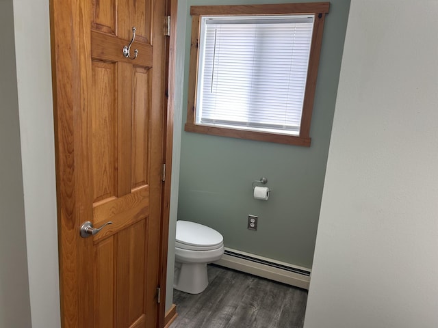 26 Island Dr, Madison, NH 03849 - bathroom featuring a baseboard heating unit and wood finished floors