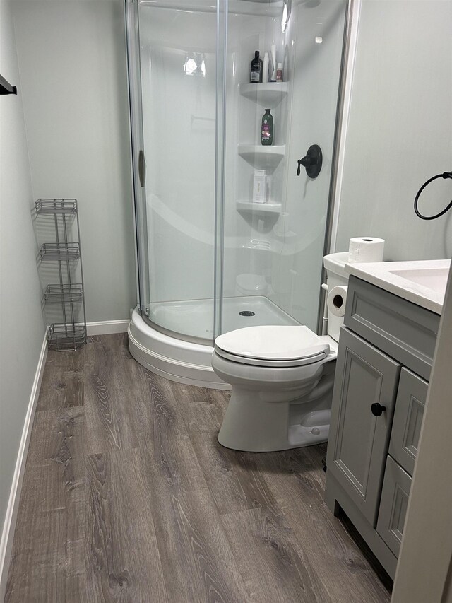 26 Island Dr, Madison, NH 03849 - bathroom featuring wood finished floors, vanity, and a stall shower