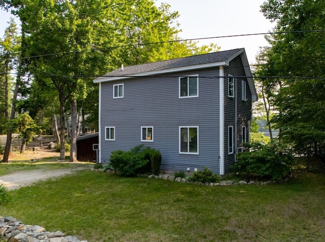 26 Island Dr, Madison, NH 03849 - view of side of home featuring a lawn and driveway
