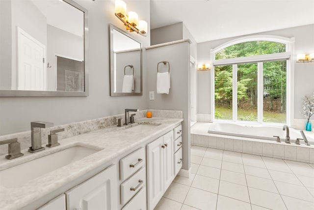 9 Hubbard Rd, Amherst, NH 03031 - bathroom with double vanity, a garden tub, and tile patterned floors