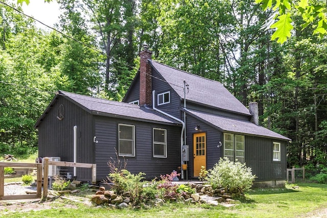 53 Broad Cove Dr, Concord, NH 03303 - view of front of house with a chimney, a front lawn, and a shingled roof