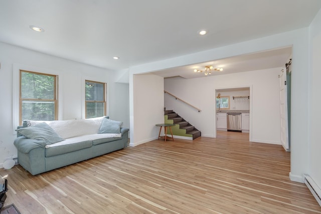53 Broad Cove Dr, Concord, NH 03303 - living room with plenty of natural light, stairs, baseboard heating, light wood-style floors, and recessed lighting