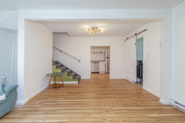 53 Broad Cove Dr, Concord, NH 03303 - entryway with light wood-style floors, stairway, a barn door, and baseboard heating