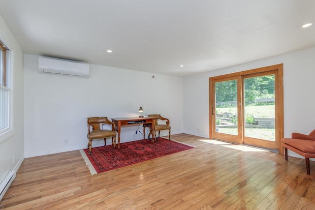 53 Broad Cove Dr, Concord, NH 03303 - sitting room featuring a wall unit AC, light wood finished floors, recessed lighting, an office area, and a baseboard heating unit