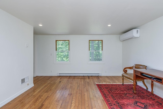 53 Broad Cove Dr, Concord, NH 03303 - sitting room featuring a wall mounted AC, a baseboard radiator, light wood-style flooring, and recessed lighting