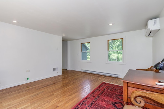 53 Broad Cove Dr, Concord, NH 03303 - unfurnished office with baseboard heating, a wall unit AC, light wood-type flooring, and recessed lighting