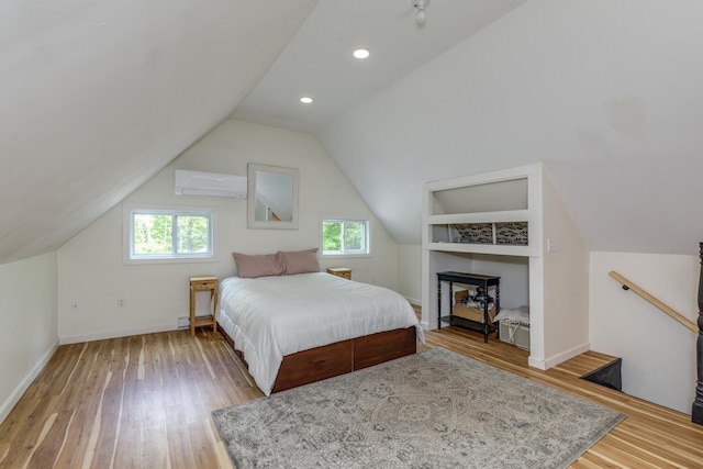 53 Broad Cove Dr, Concord, NH 03303 - bedroom with an AC wall unit, multiple windows, wood finished floors, vaulted ceiling, and recessed lighting