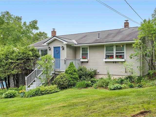 89 Carlson Rd, Worcester, VT 05682 - view of front of home featuring a chimney, a front yard, and a shingled roof