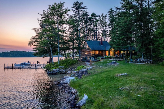 310 Bear Is, Meredith, NH 03253 - dock featuring a water view and a lawn
