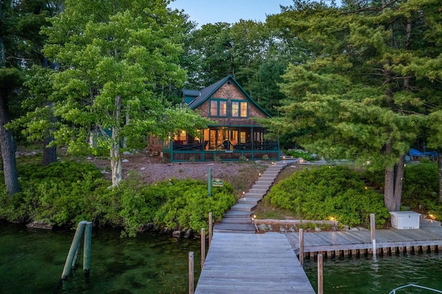 310 Bear Is, Meredith, NH 03253 - back of property with a water view and stairway