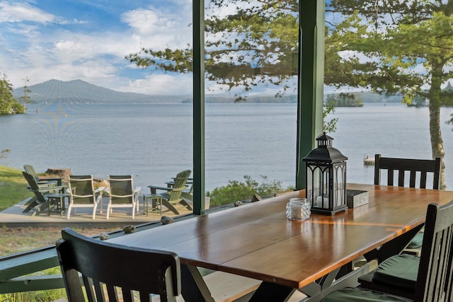 310 Bear Is, Meredith, NH 03253 - dining space featuring a water view and plenty of natural light