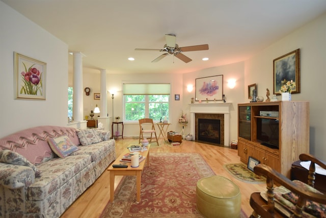 51 Fielding Ln, South Burlington, VT 05403 - living area featuring light wood-style floors, ornate columns, ceiling fan, a glass covered fireplace, and recessed lighting