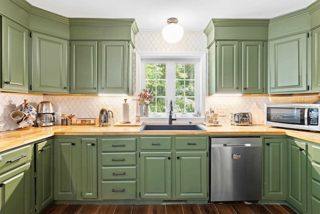 38 Piscataqua Rd, Dover, NH 03820 - kitchen with appliances with stainless steel finishes, wood counters, tasteful backsplash, and dark wood-type flooring