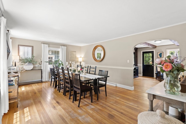 38 Piscataqua Rd, Dover, NH 03820 - dining room with arched walkways and light wood finished floors