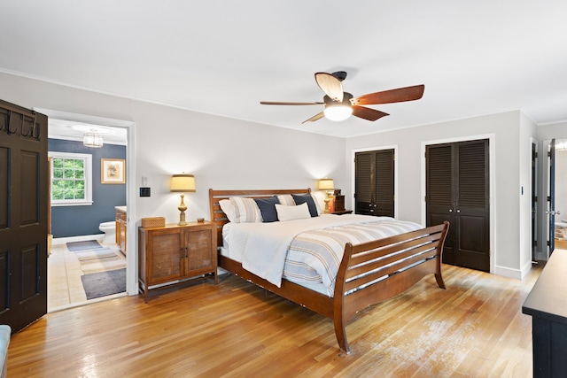 38 Piscataqua Rd, Dover, NH 03820 - bedroom with multiple closets, light wood finished floors, ornamental molding, connected bathroom, and ceiling fan
