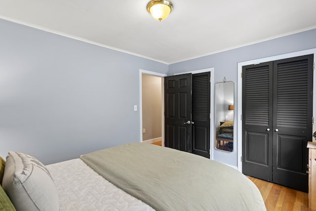 38 Piscataqua Rd, Dover, NH 03820 - bedroom with two closets, light wood-style floors, and ornamental molding