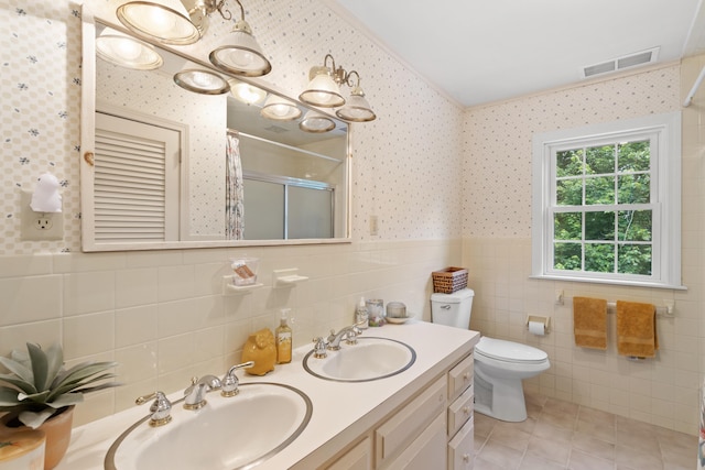 38 Piscataqua Rd, Dover, NH 03820 - full bath with wallpapered walls, curtained shower, tile patterned flooring, wainscoting, and double vanity