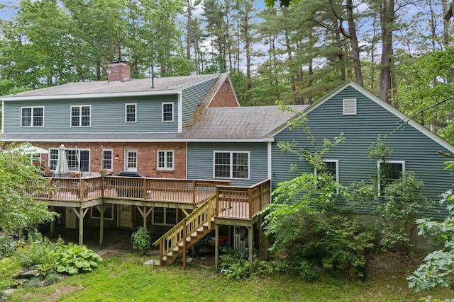 38 Piscataqua Rd, Dover, NH 03820 - rear view of property featuring a wooden deck, a chimney, stairway, a shingled roof, and brick siding