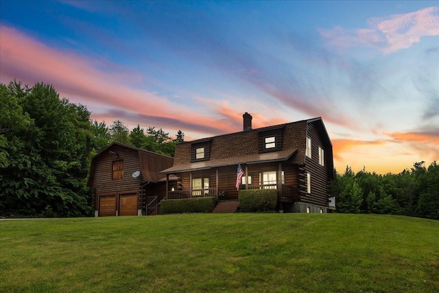110 W Milan Rd, Milan, NH 03588 - cabin featuring a gambrel roof, a porch, a garage, a chimney, and a lawn